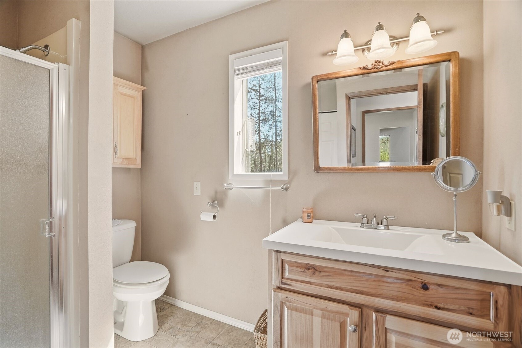 12119 South Spotted Road Cheney, WA 99004 - Photo 24 of 40 a bathroom with a toilet a sink and a mirror