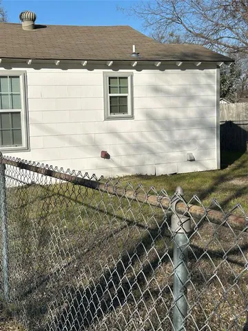 a view of a backyard of the house