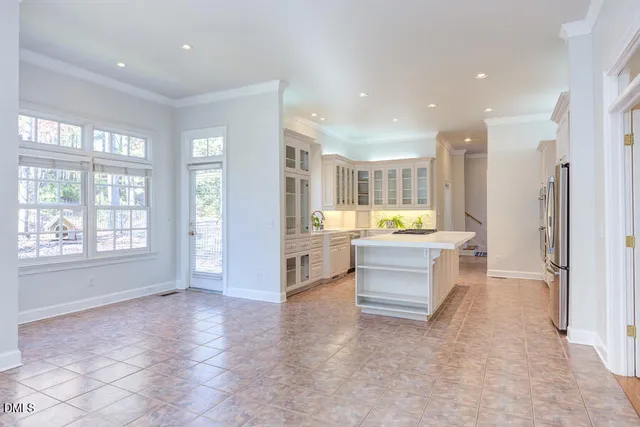 a view of a livingroom with a fireplace and window