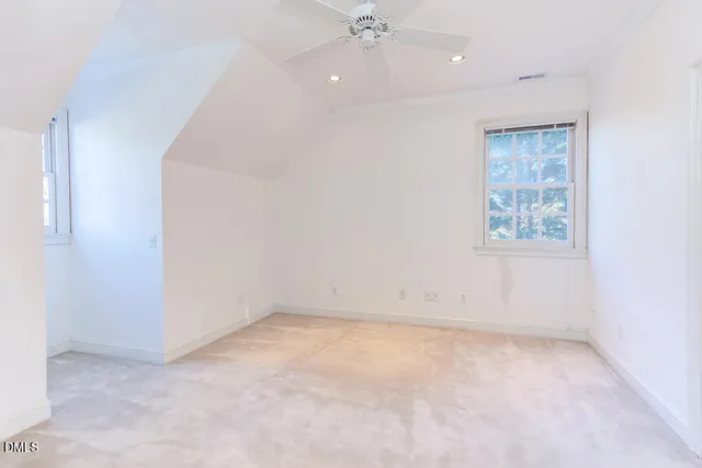 a bathroom with a granite countertop sink mirror vanity and toilet