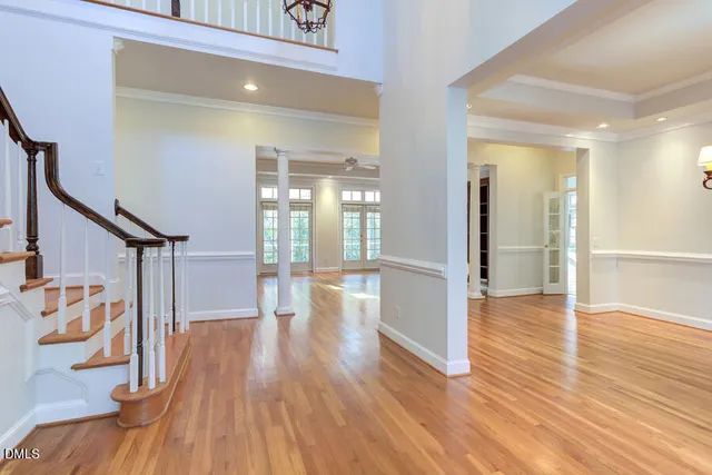 a view of entryway with wooden floor and stairs