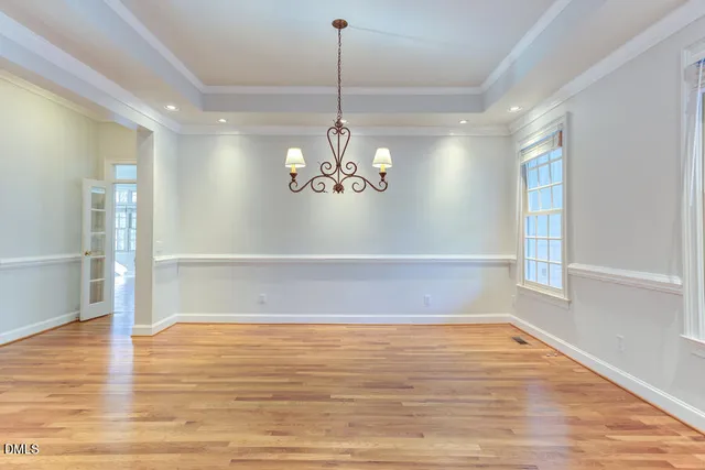 a view of an entryway with wooden floor and stairs