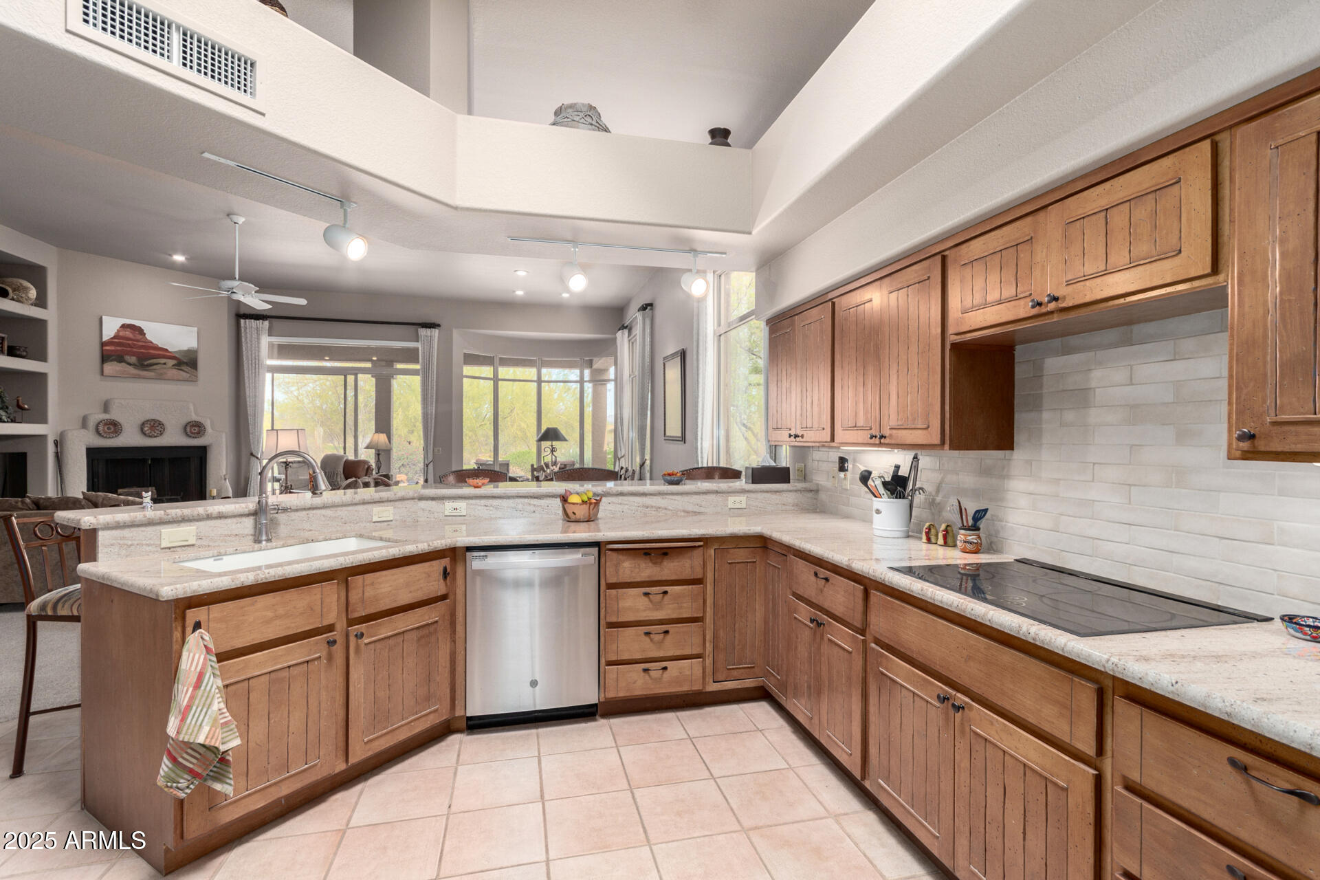 a large kitchen with a sink and cabinets