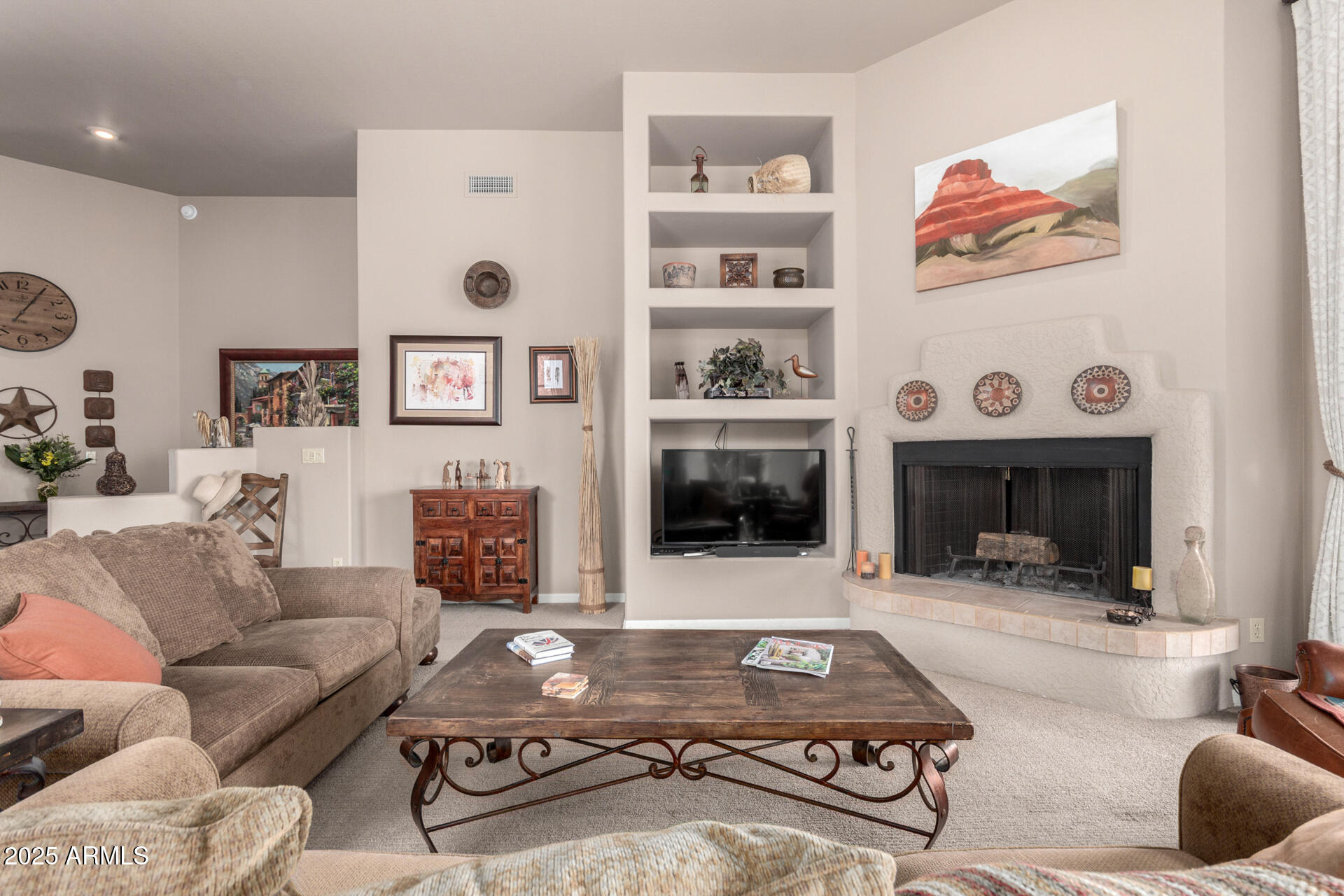 18610 Amarado Circle Rio Verde, AZ 85263 - Photo 12 of 58 a living room with furniture and a fireplace