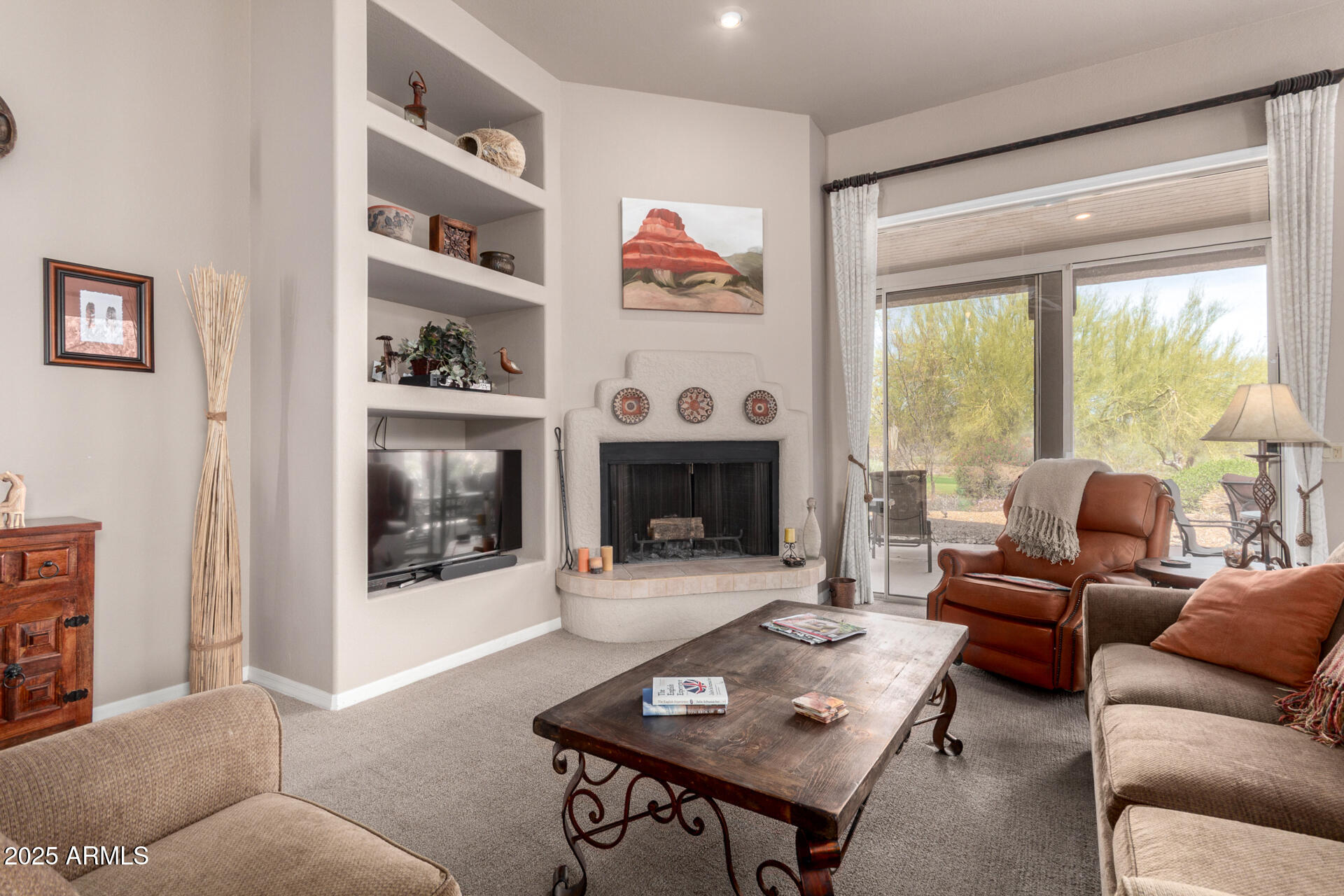 18610 Amarado Circle Rio Verde, AZ 85263 - Photo 13 of 58 a living room with furniture a rug and a fireplace
