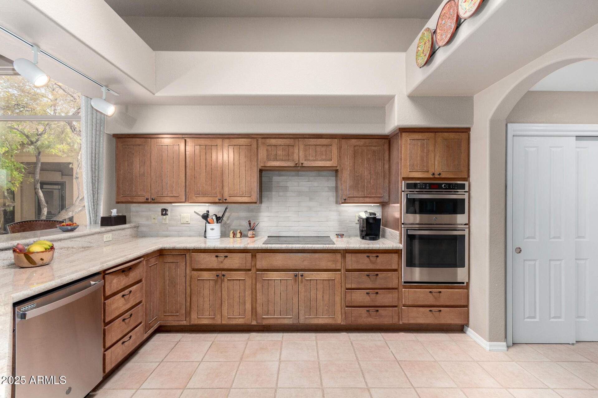 18610 Amarado Circle Rio Verde, AZ 85263 - Photo 17 of 58 a kitchen with a sink stove and cabinets