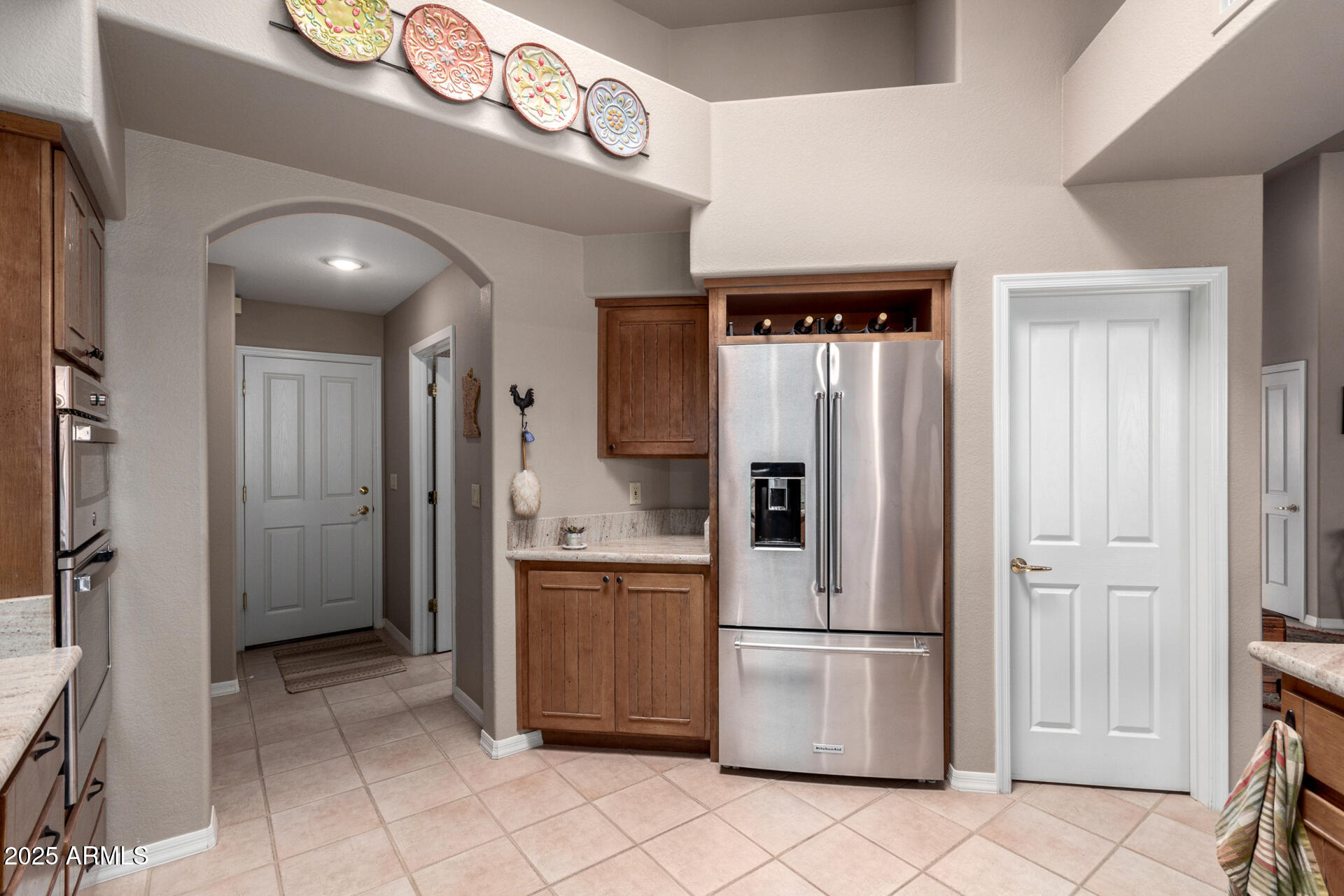 18610 Amarado Circle Rio Verde, AZ 85263 - Photo 18 of 58 a kitchen with stainless steel appliances granite countertop a refrigerator and a sink