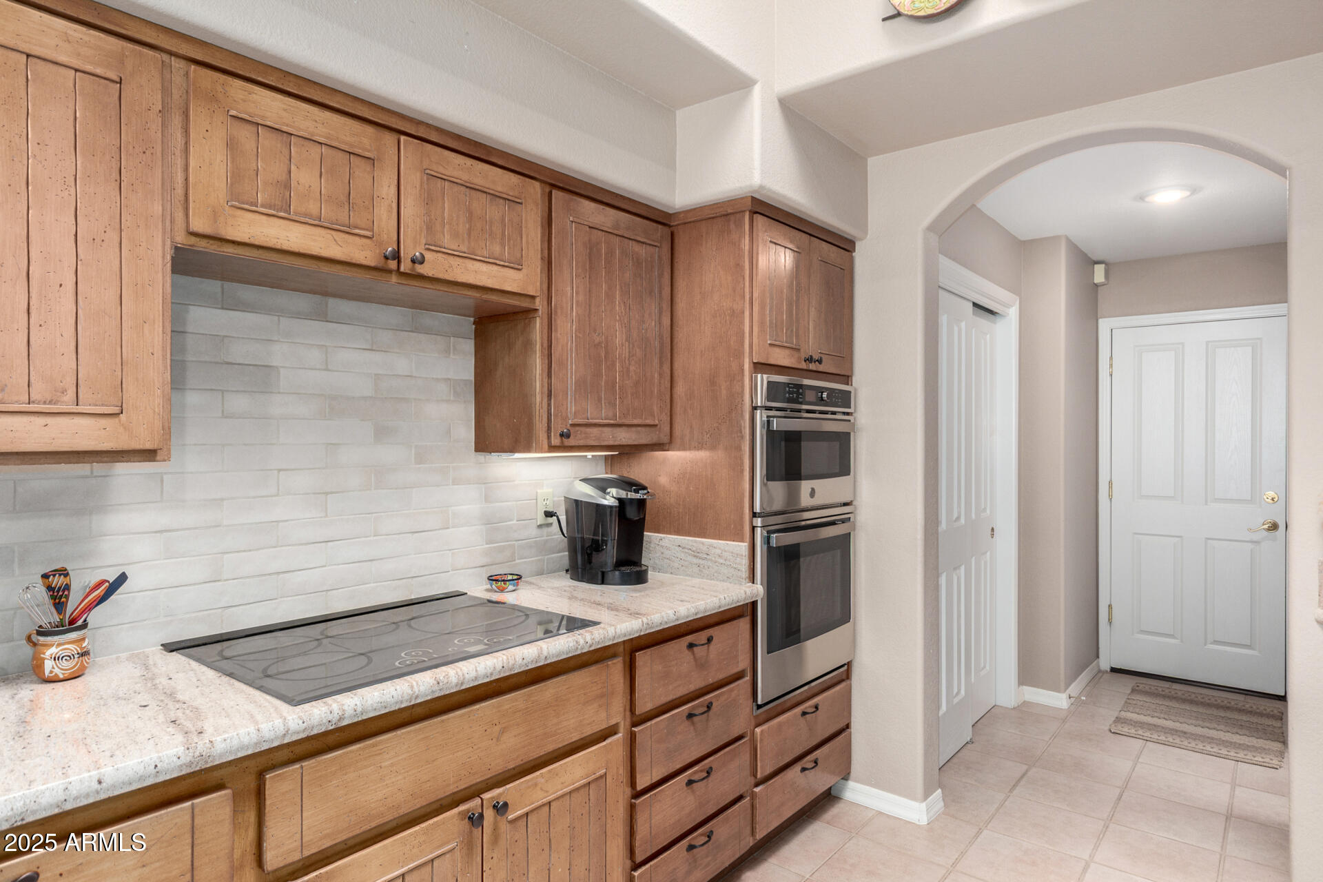 18610 Amarado Circle Rio Verde, AZ 85263 - Photo 19 of 58 a kitchen with granite countertop cabinets and steel stainless steel appliances