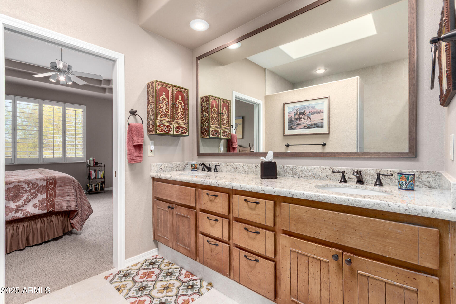 18610 Amarado Circle Rio Verde, AZ 85263 - Photo 25 of 58 a en suite bathroom with double vanity sinks a mirror and a painting on the wall