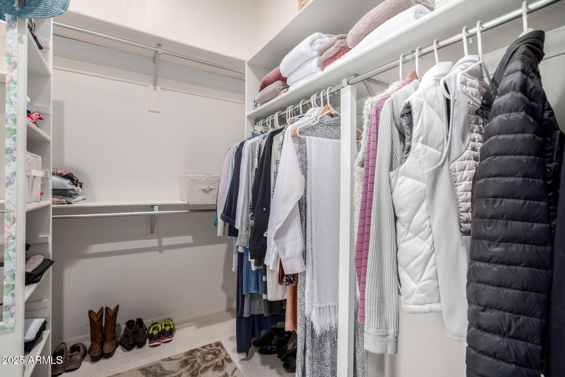18610 Amarado Circle Rio Verde, AZ 85263 - Photo 29 of 58 a view of walk in closet with clothes and shoes