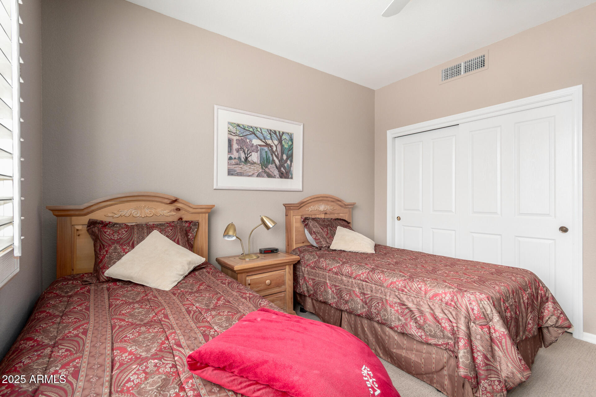 18610 Amarado Circle Rio Verde, AZ 85263 - Photo 32 of 58 a bedroom with two beds and a painting on the wall