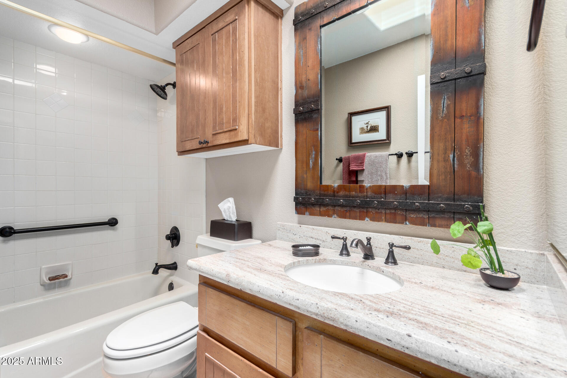 18610 Amarado Circle Rio Verde, AZ 85263 - Photo 33 of 58 a bathroom with a granite countertop sink toilet and shower