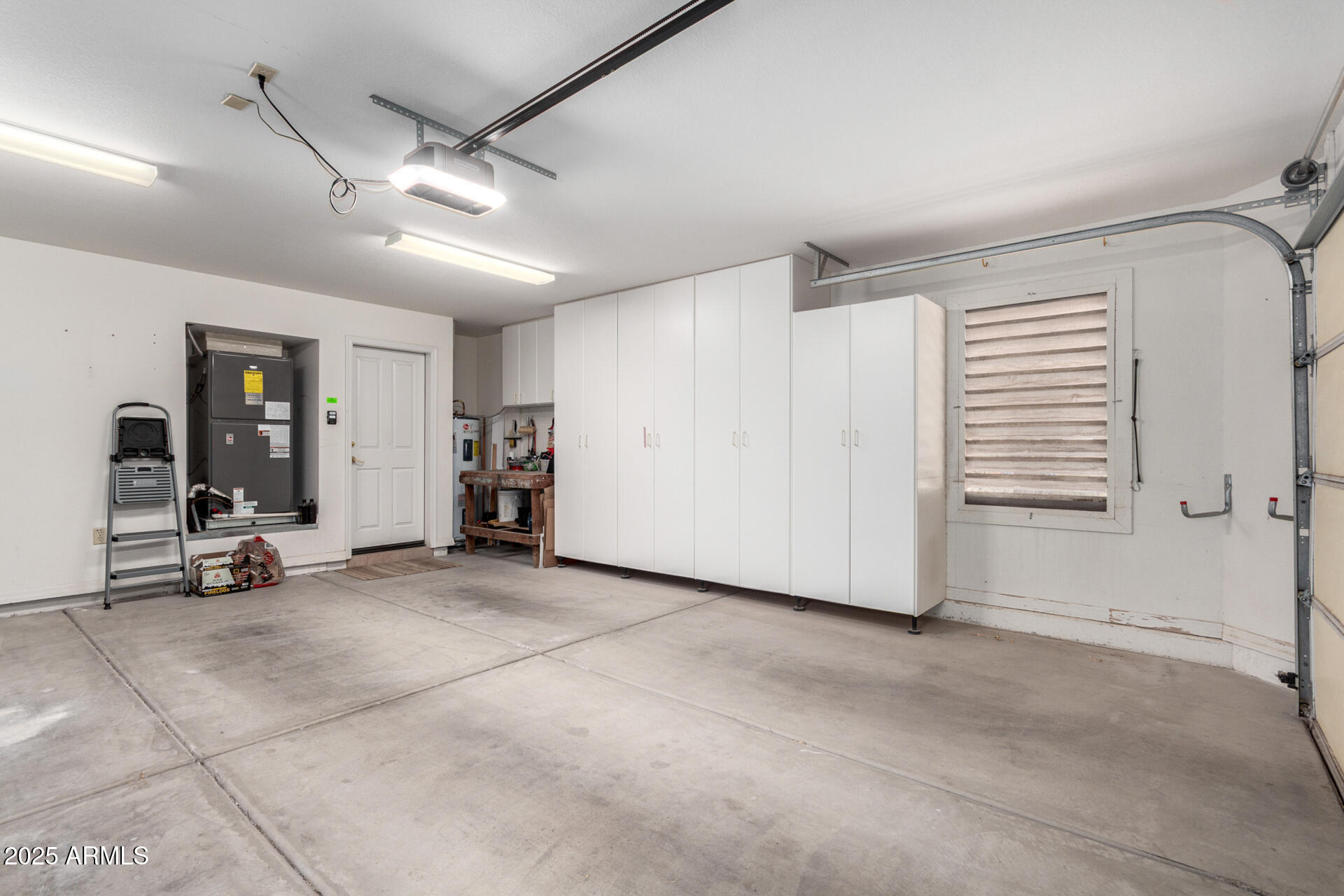 18610 Amarado Circle Rio Verde, AZ 85263 - Photo 39 of 58 a view of a garage with furniture and a car parked
