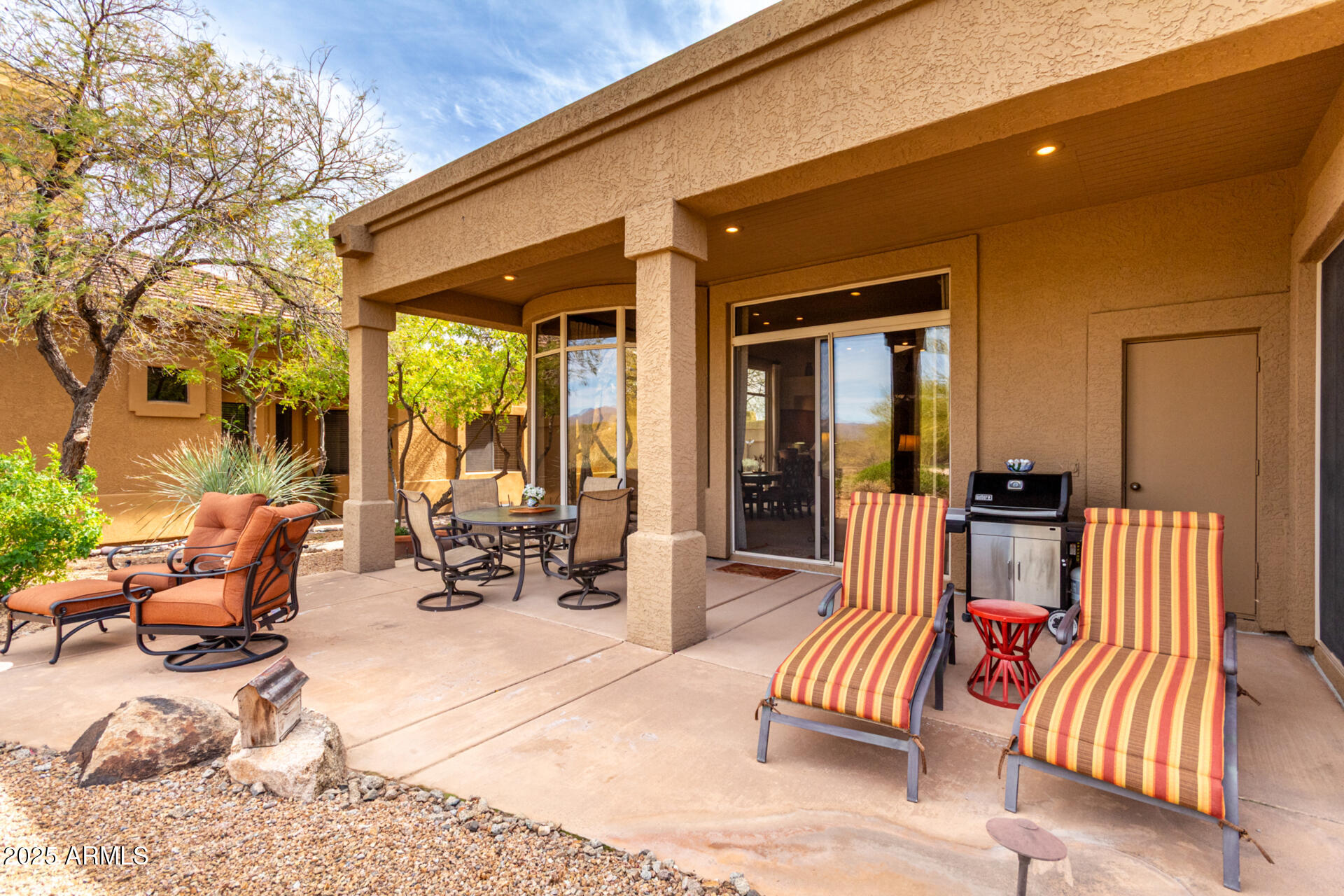 18610 Amarado Circle Rio Verde, AZ 85263 - Photo 40 of 58 a view of a patio with a chairs and table in the patio