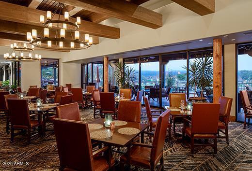18610 Amarado Circle Rio Verde, AZ 85263 - Photo 50 of 58 a view of a dining room with furniture large windows and wooden floor