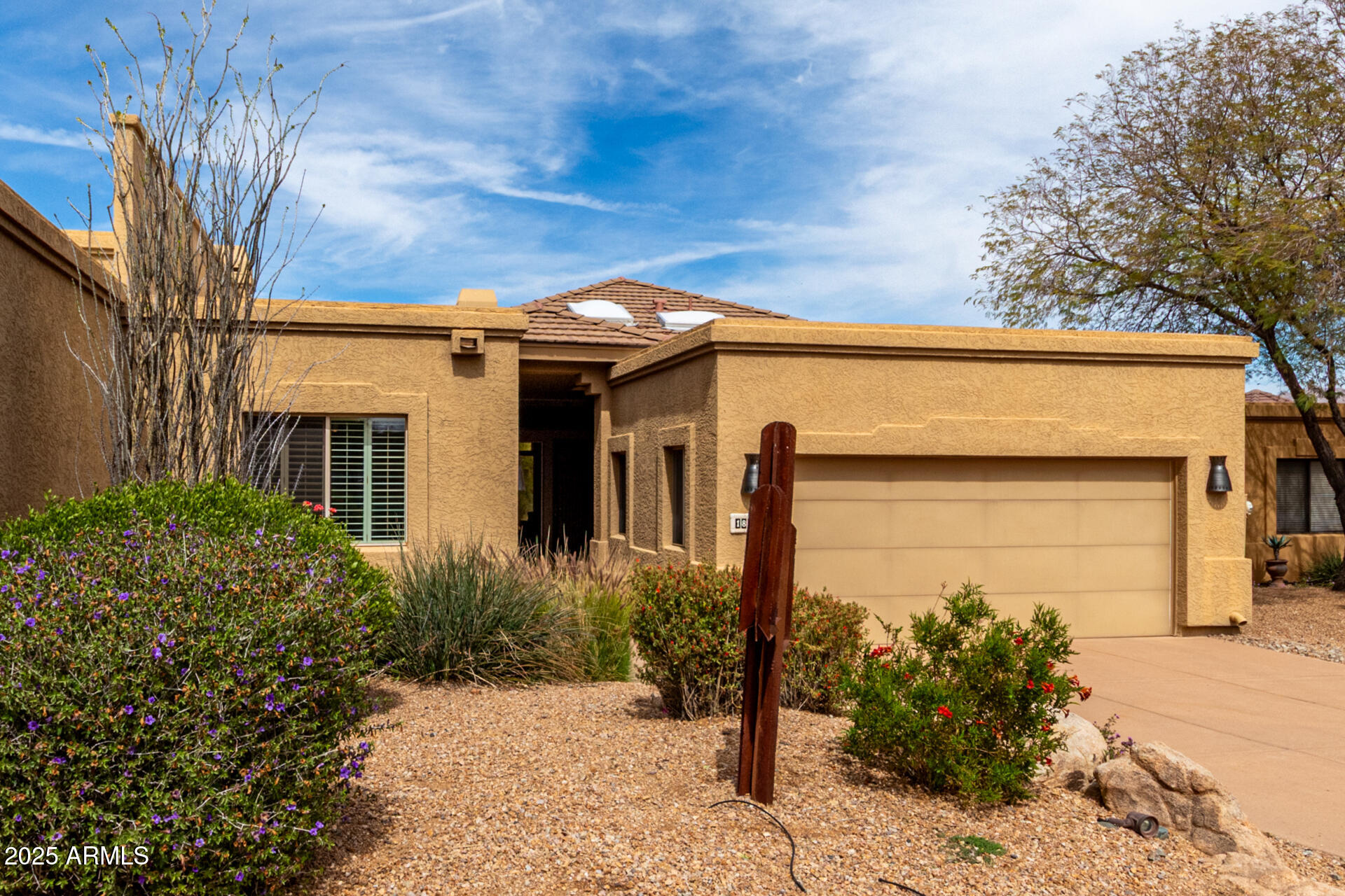 18610 Amarado Circle Rio Verde, AZ 85263 - Photo 7 of 58 a front view of a house with garden
