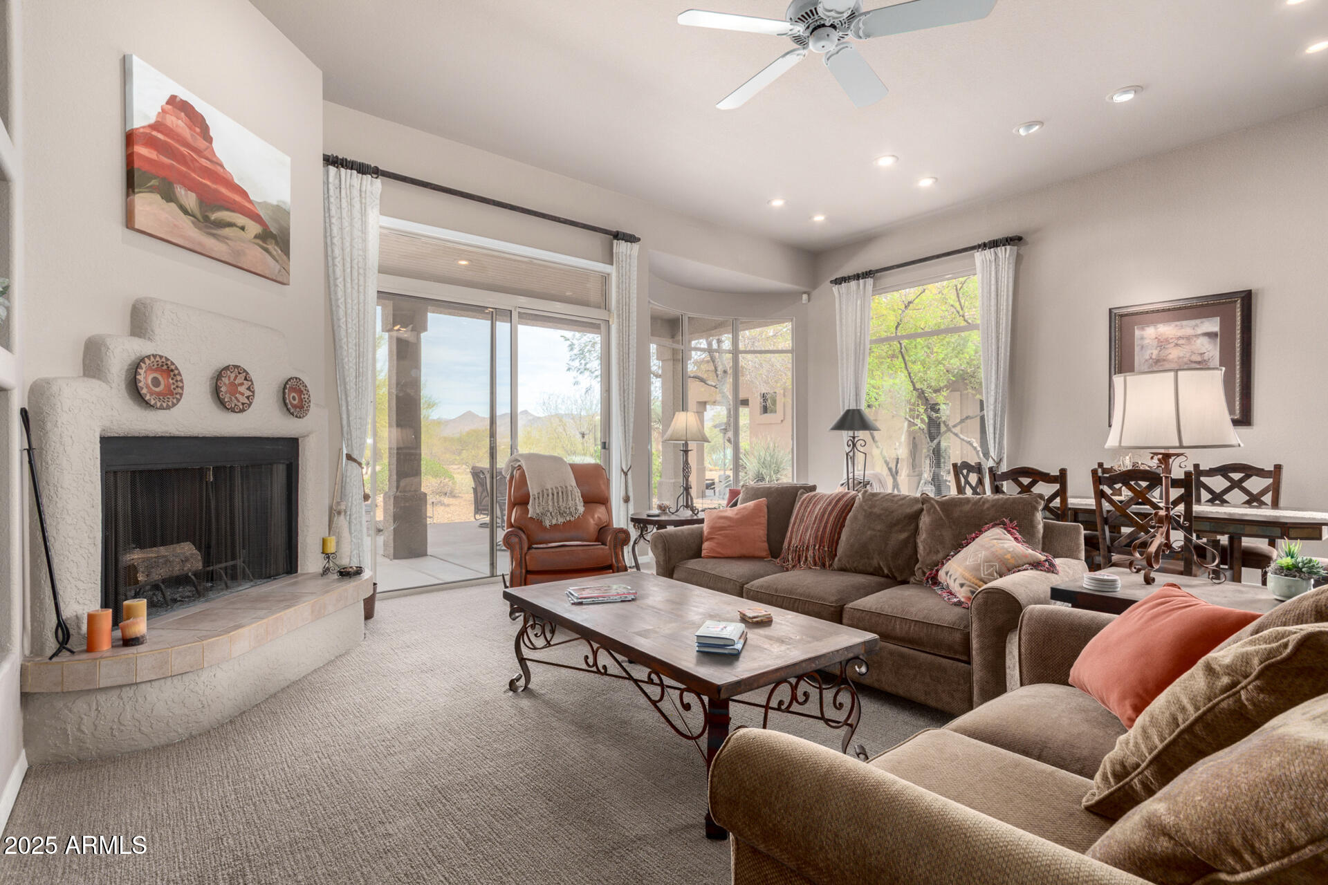 18610 Amarado Circle Rio Verde, AZ 85263 - Photo 10 of 58 a living room with furniture and a fireplace