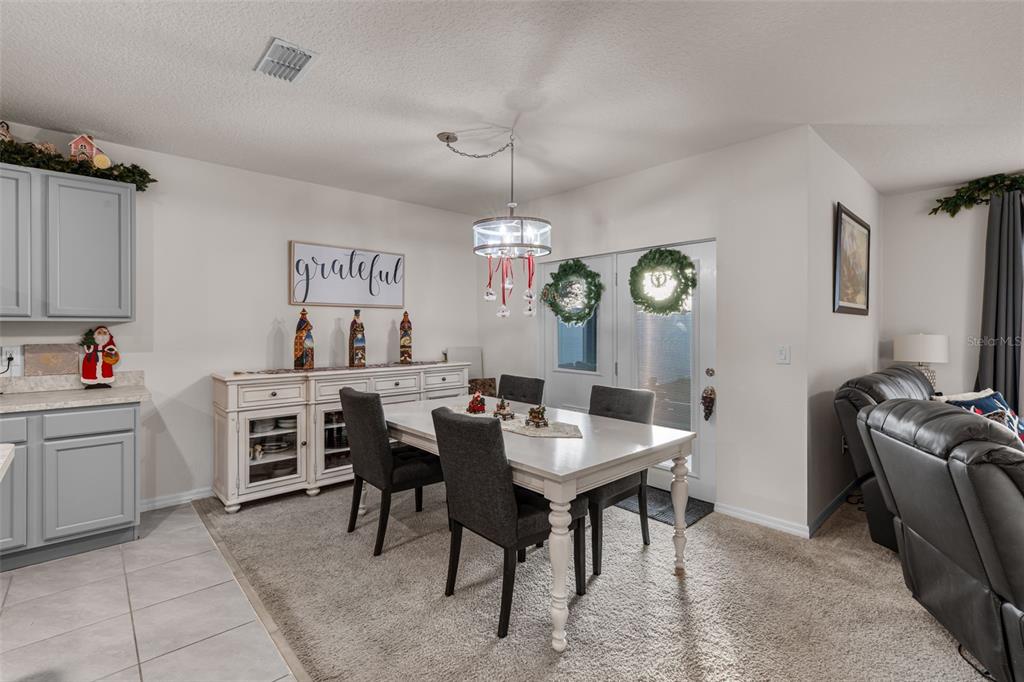 1523 White Hawk Way Groveland, FL 34736 - Photo 14 of 24 a view of kitchen and dining area with furniture