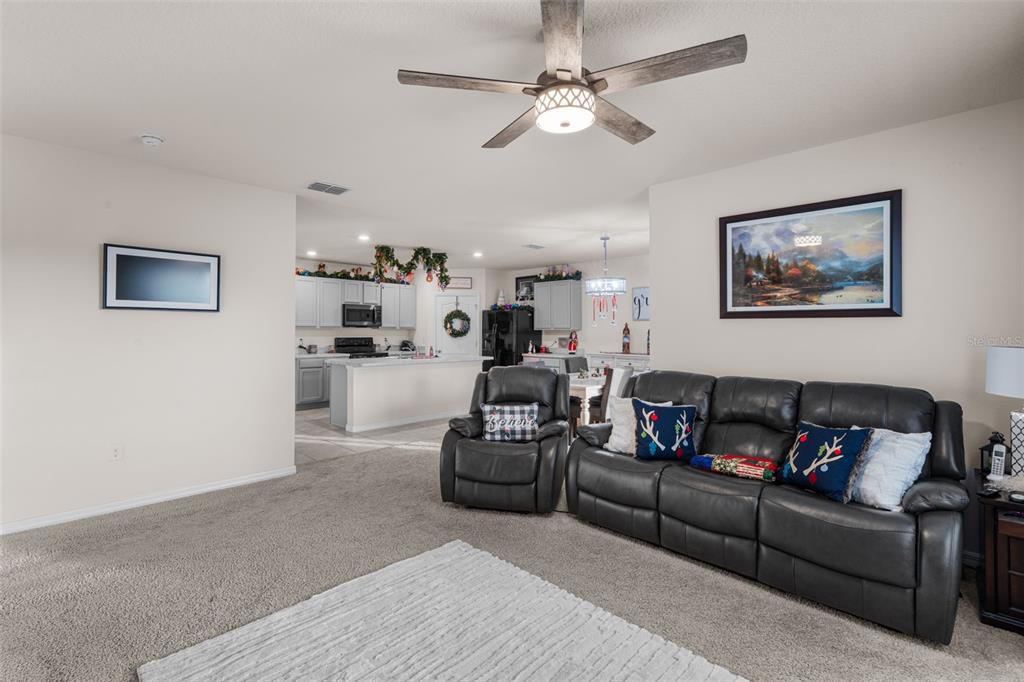 1523 White Hawk Way Groveland, FL 34736 - Photo 17 of 24 a living room with furniture and a ceiling fan