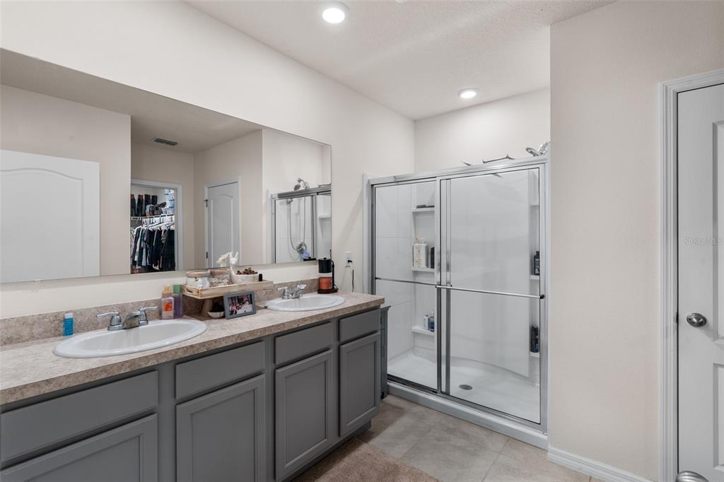 1523 White Hawk Way Groveland, FL 34736 - Photo 20 of 24 a bathroom with a double vanity sink mirror and double