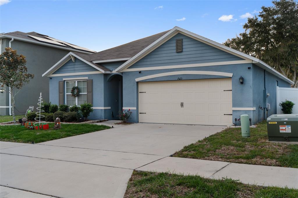 1523 White Hawk Way Groveland, FL 34736 - Photo 2 of 24 a front view of a house with a yard and garage