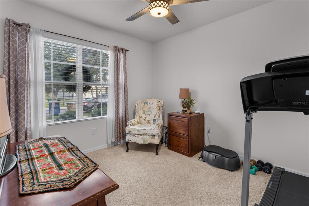 1523 White Hawk Way Groveland, FL 34736 - Photo 4 of 24 a bedroom with furniture and a window