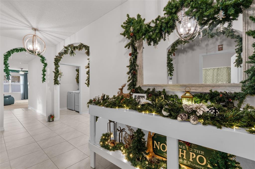 1523 White Hawk Way Groveland, FL 34736 - Photo 7 of 24 a front view of a house with a yard and potted plants