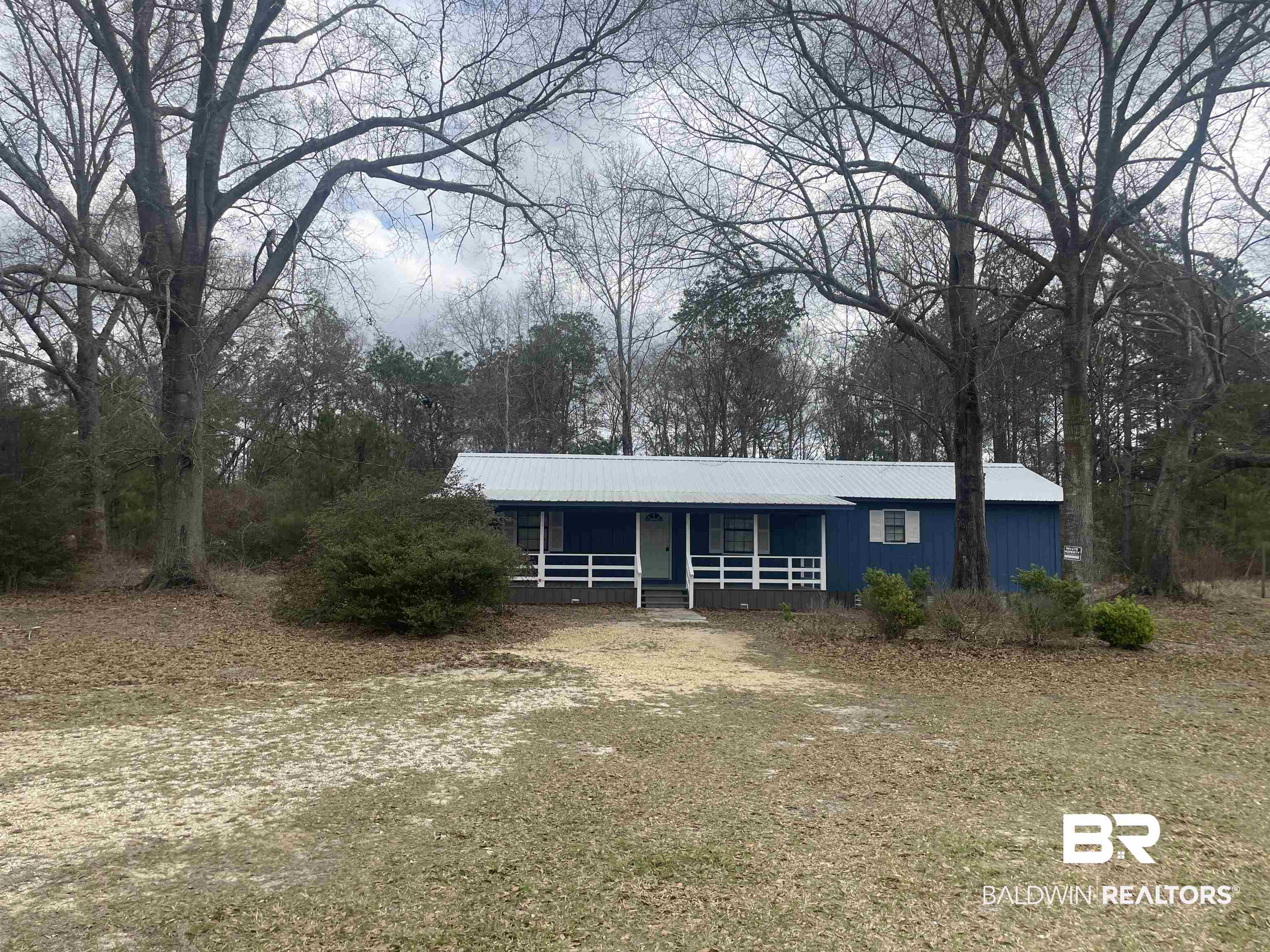 28414 Highway 31 Flomaton, AL 36441 - Photo 1 of 11 View of front of home Hardy plank exterior with a porch and a New metal roof