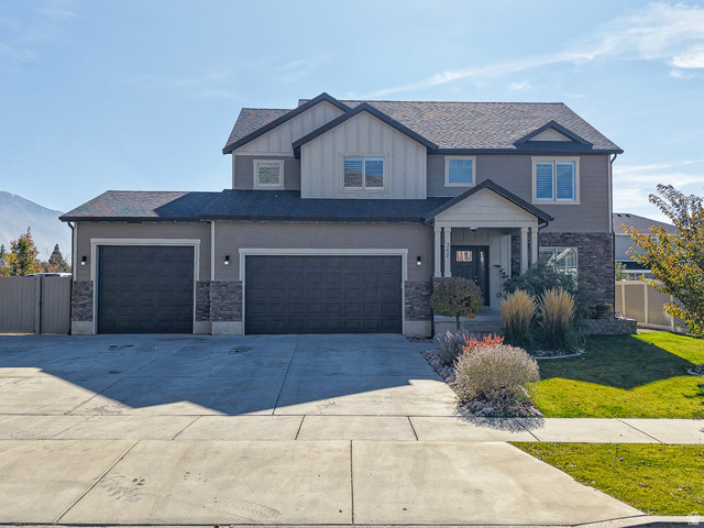 368 East 700 North Springville, UT 84663 - Photo 1 of 55 View of front facade featuring stone siding, board and batten siding, driveway, and a gate