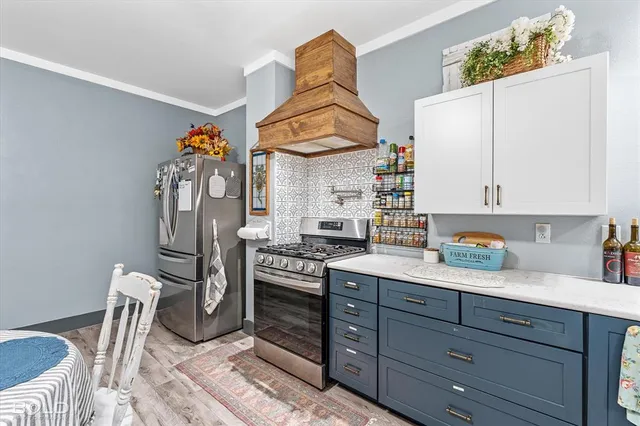 a kitchen with a sink cabinets and window