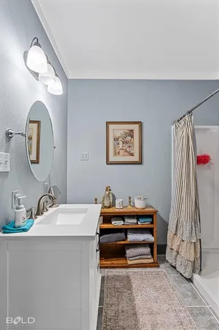 a view of a workspace with furniture and a kitchen