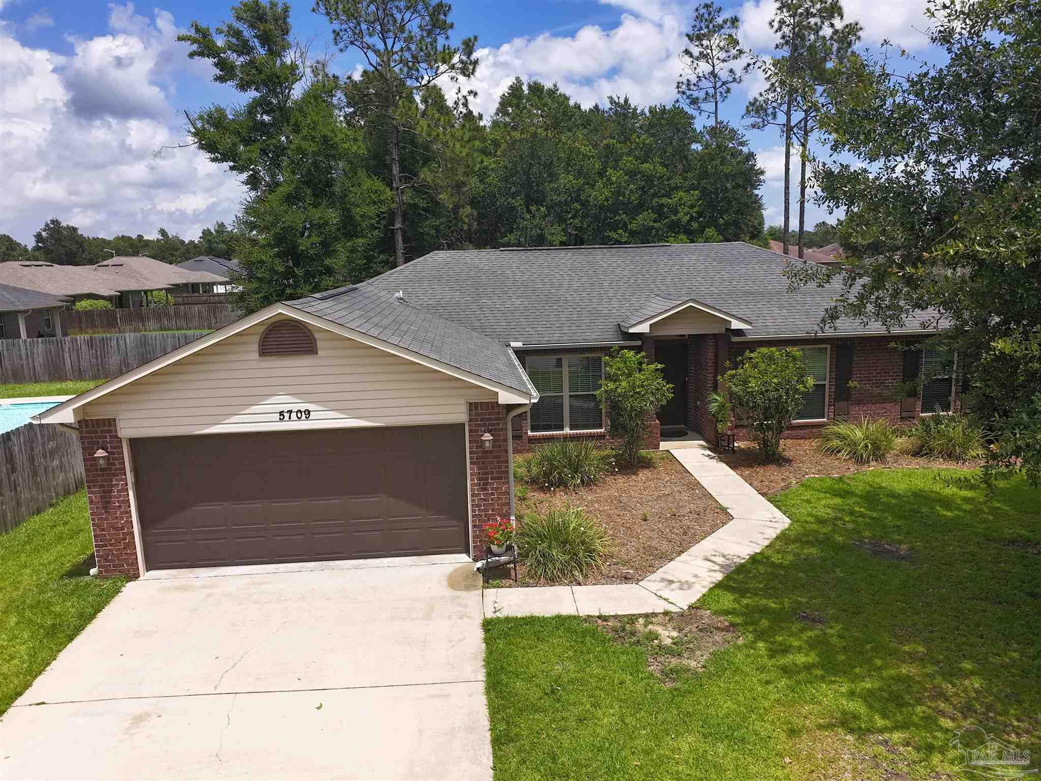 5709 Mill Stream Way Pace, FL 32571 - Photo 15 of 48 a aerial view of a house with a yard