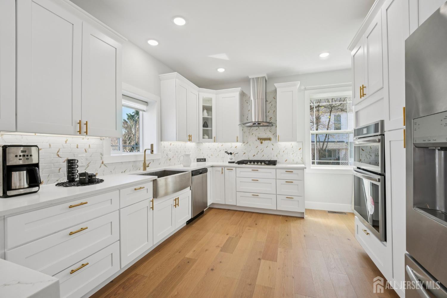 75 Jefferson Boulevard Edison, NJ 08817 - Photo 15 of 75 a kitchen with granite countertop white cabinets and white appliances