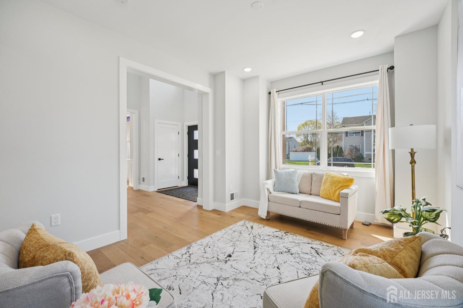 75 Jefferson Boulevard Edison, NJ 08817 - Photo 20 of 75 a living room with furniture and a large window