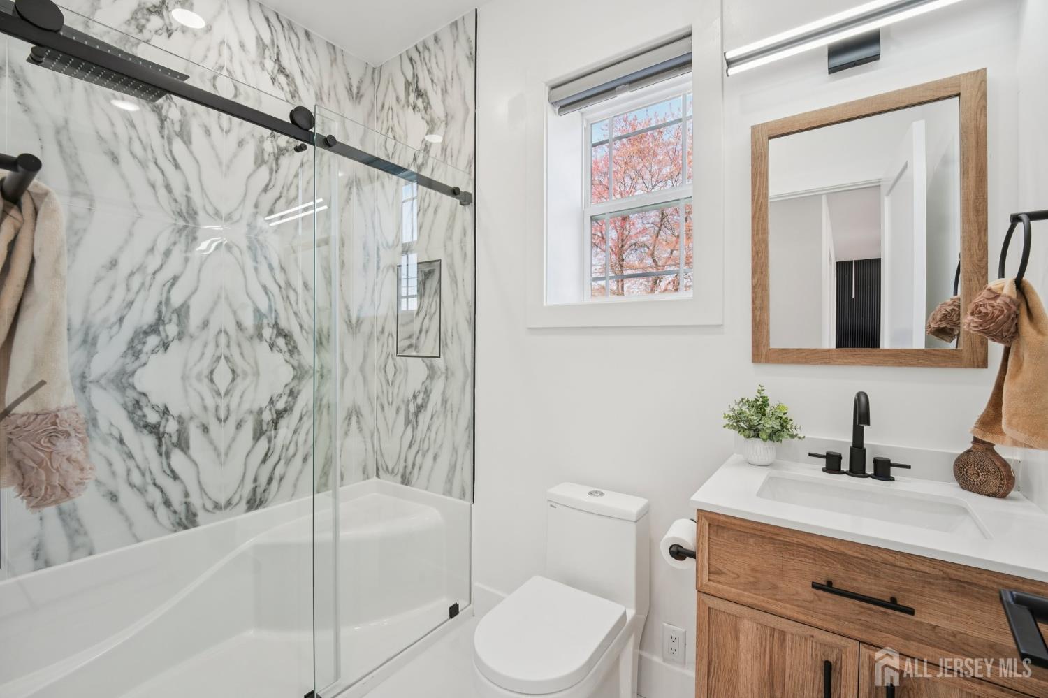 75 Jefferson Boulevard Edison, NJ 08817 - Photo 21 of 75 a bathroom with a granite countertop sink toilet and shower