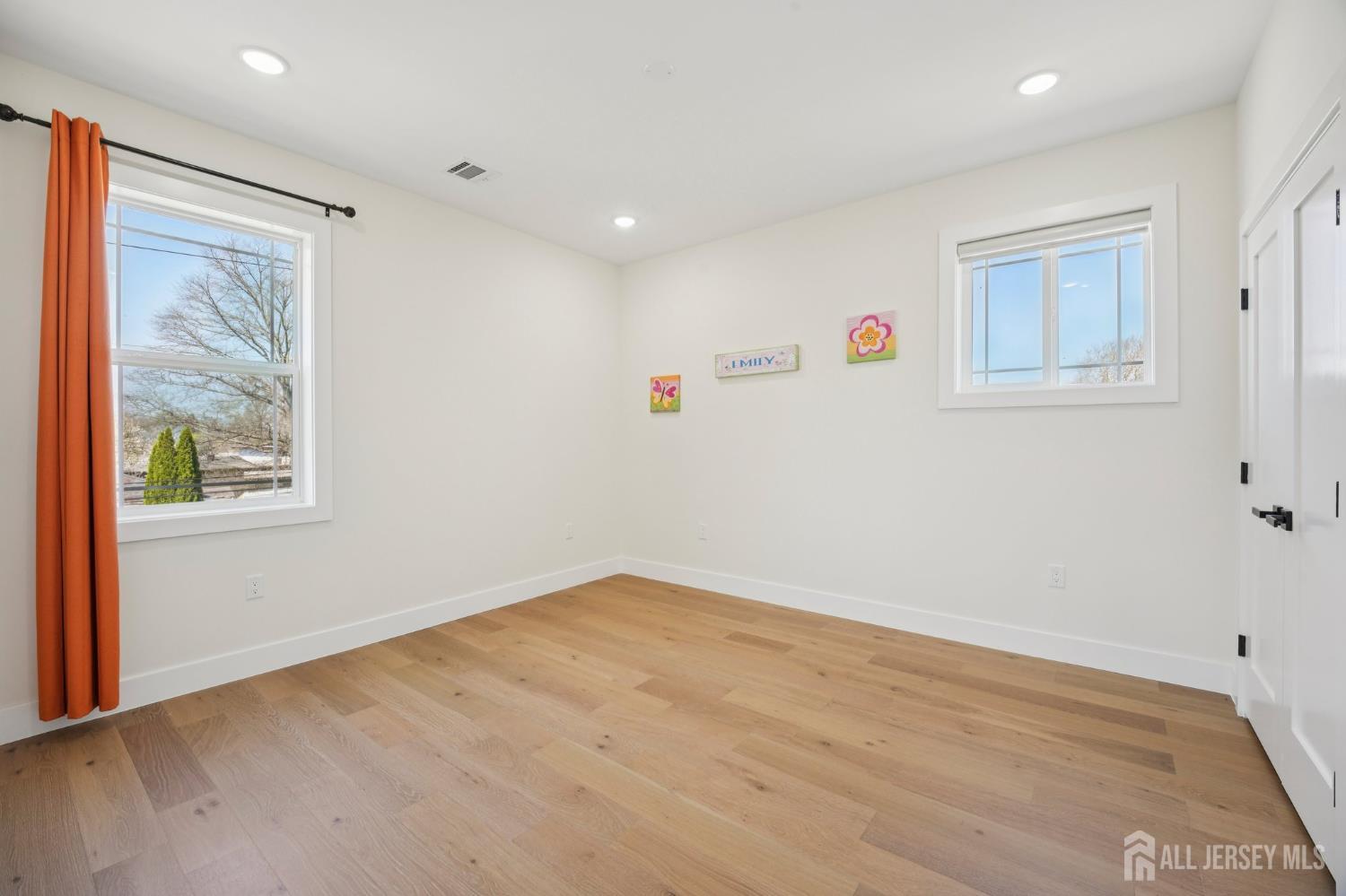 75 Jefferson Boulevard Edison, NJ 08817 - Photo 34 of 75 a view of empty room with wooden floor and fan