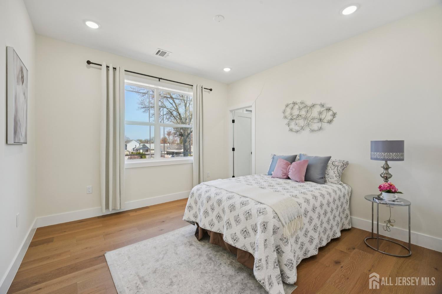 75 Jefferson Boulevard Edison, NJ 08817 - Photo 37 of 75 a bedroom with a large bed and a window