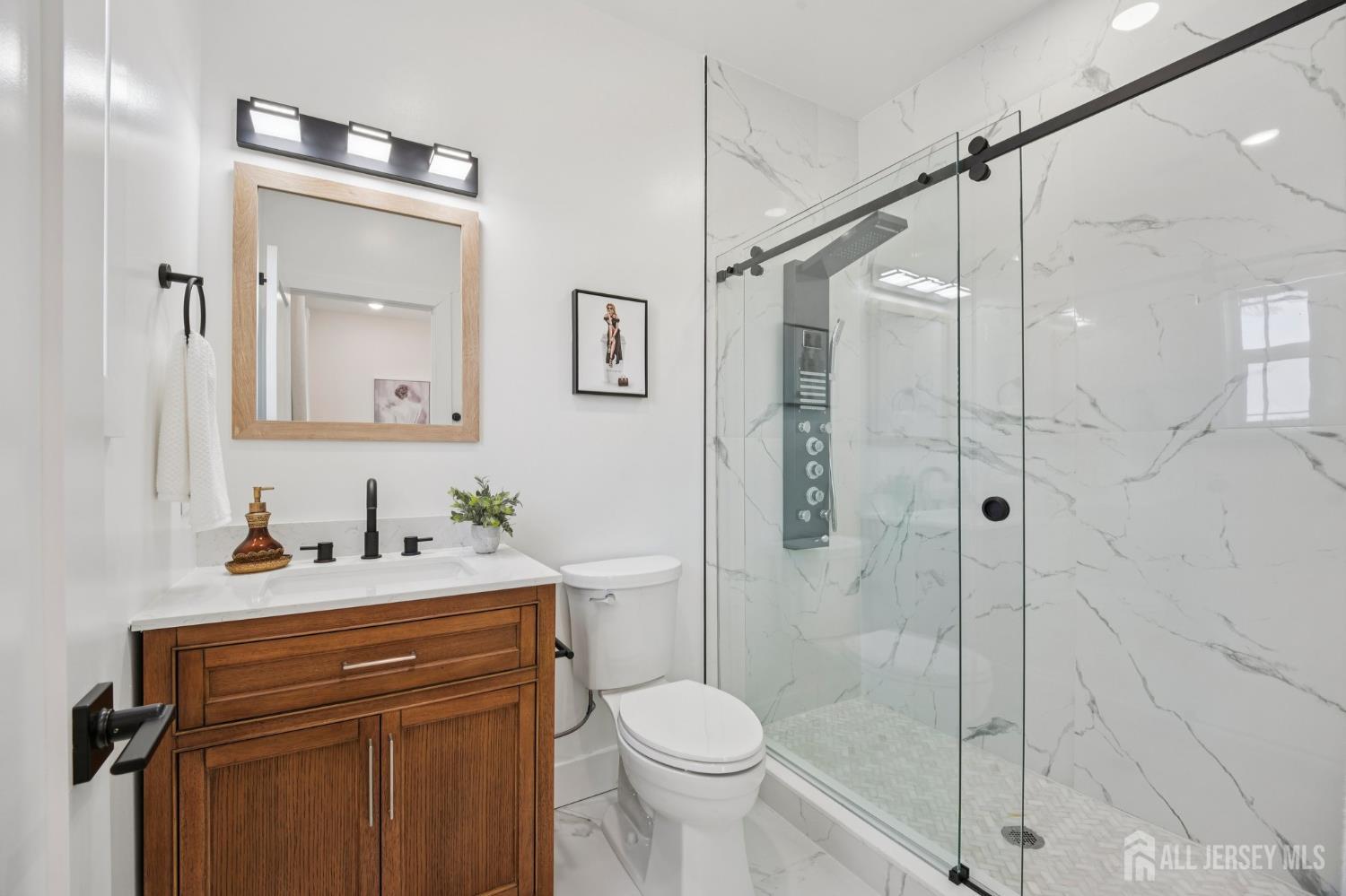 75 Jefferson Boulevard Edison, NJ 08817 - Photo 39 of 75 a bathroom with a sink toilet and shower