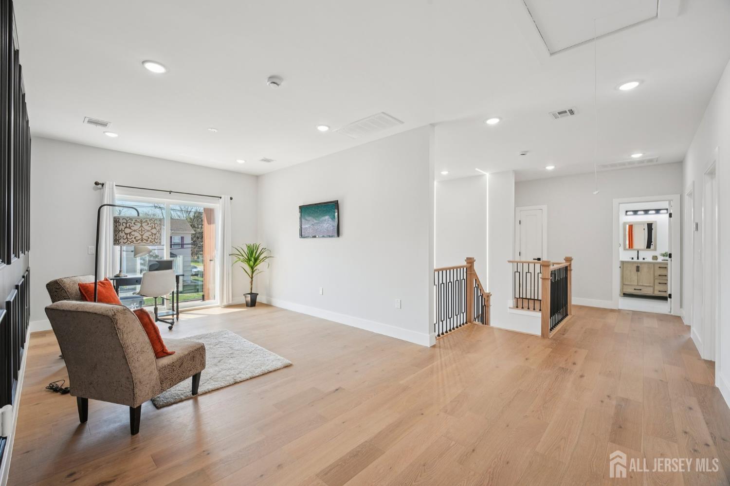 75 Jefferson Boulevard Edison, NJ 08817 - Photo 46 of 75 a view of a livingroom with furniture and a potted plant