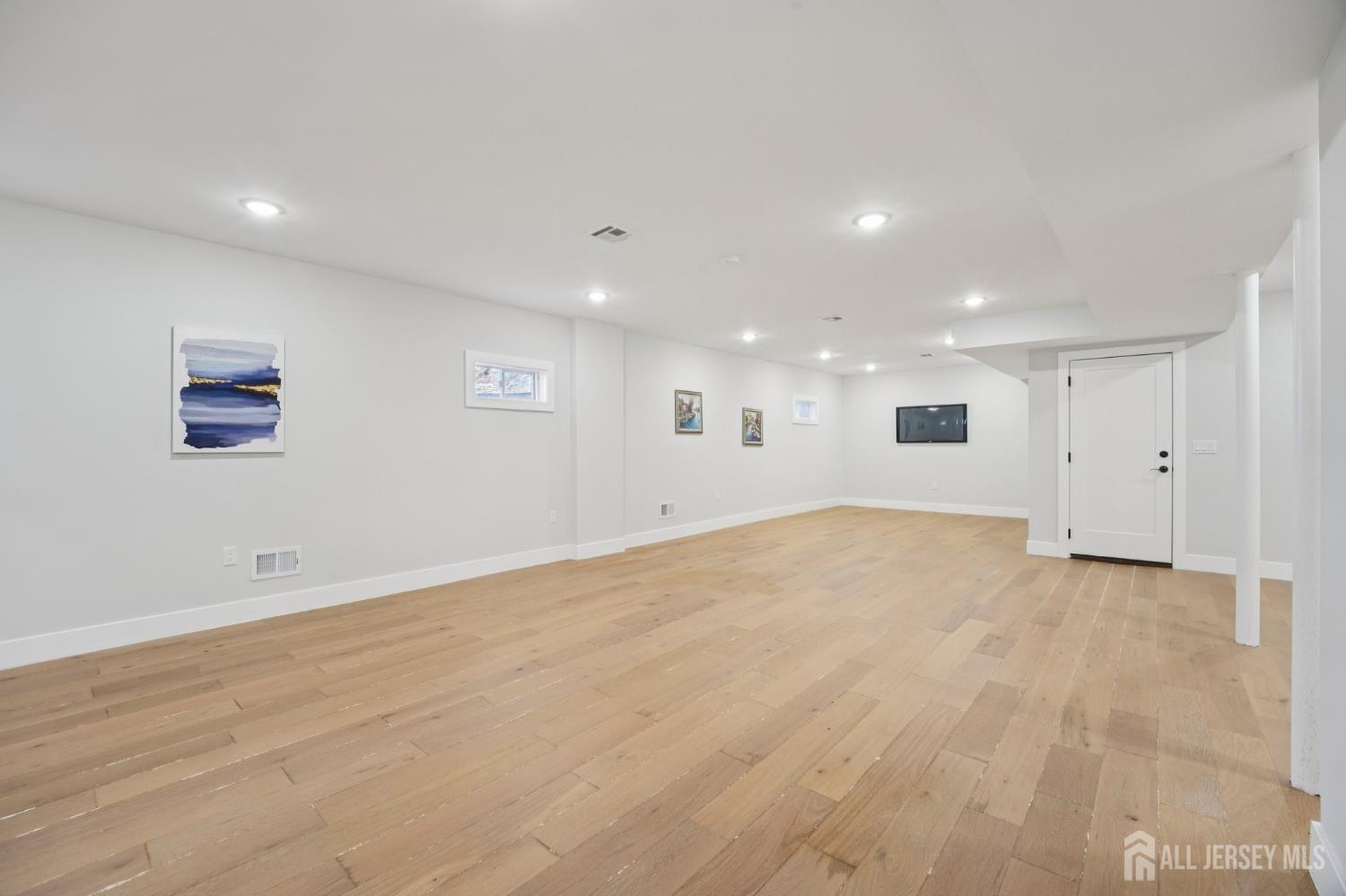 75 Jefferson Boulevard Edison, NJ 08817 - Photo 50 of 75 a view of an empty room with wooden floor