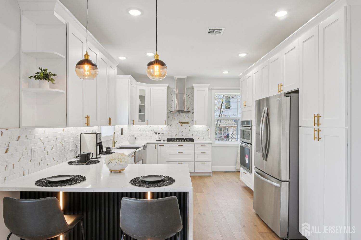 75 Jefferson Boulevard Edison, NJ 08817 - Photo 59 of 75 a kitchen with refrigerator and cabinets