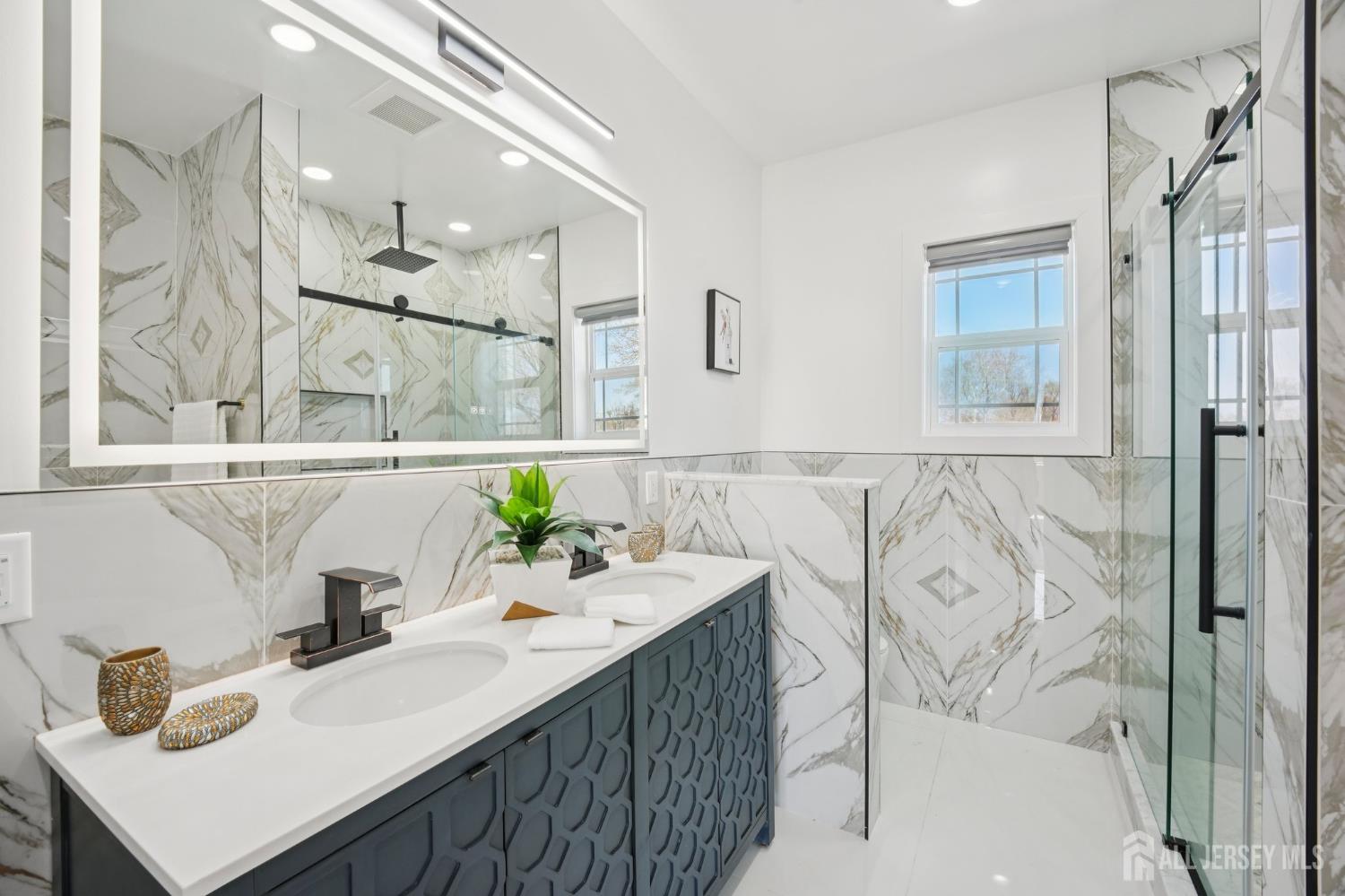75 Jefferson Boulevard Edison, NJ 08817 - Photo 60 of 75 a bathroom with a sink mirror and a bathtub