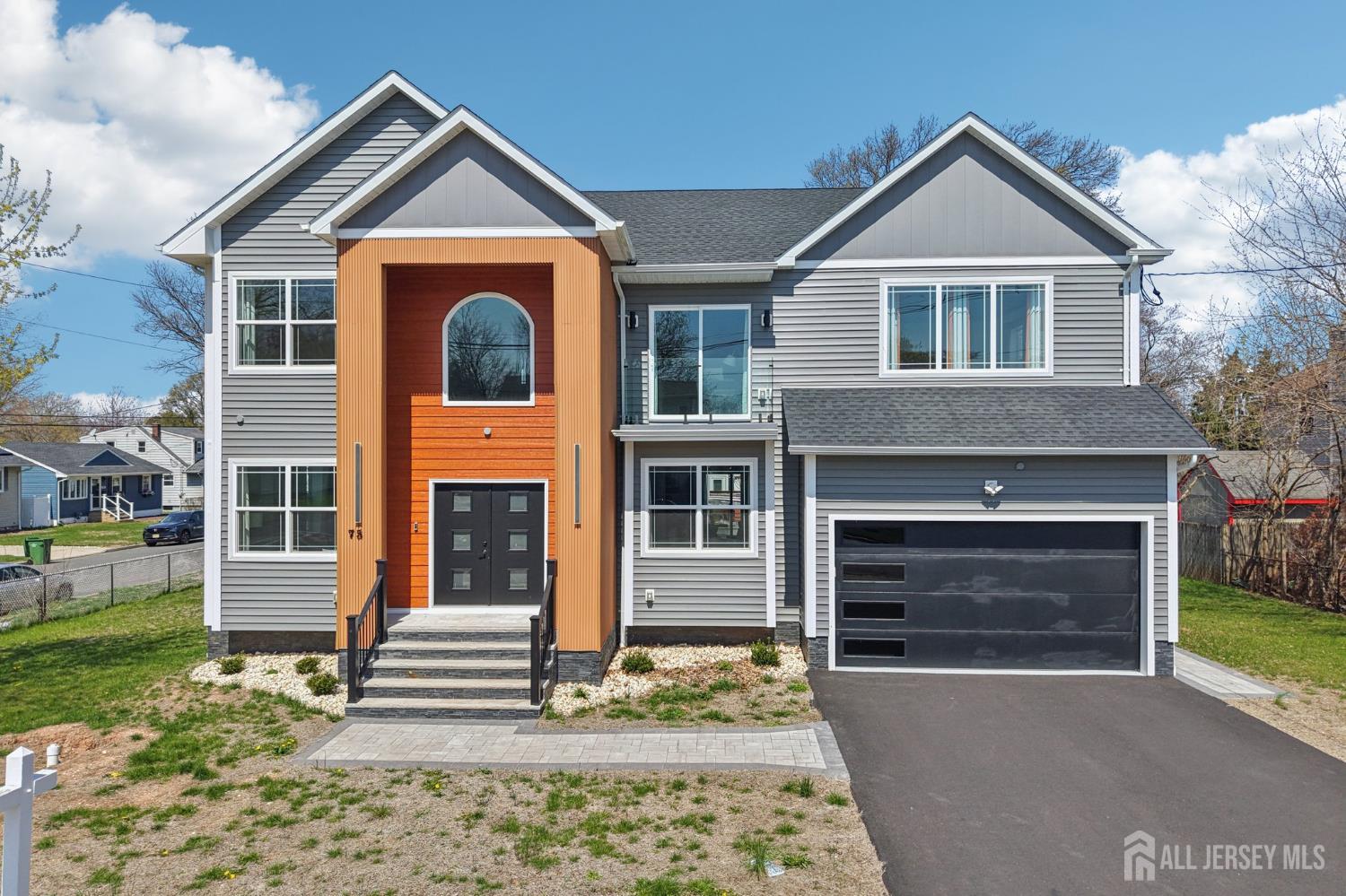75 Jefferson Boulevard Edison, NJ 08817 - Photo 66 of 75 a front view of a house with a yard