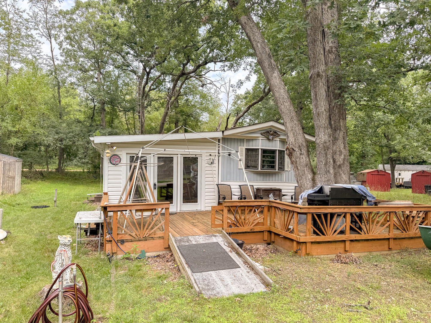 a view of a house with pool porch and chairs