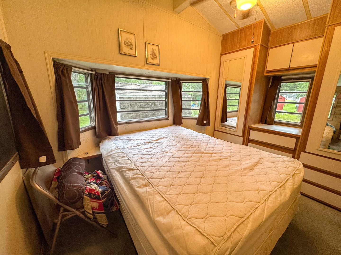 2-24 Woodhaven Sublette, IL 61367 - Photo 15 of 17 a bed sitting in a bedroom next to a window