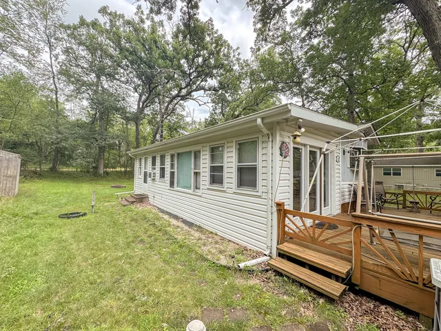 a view of a house with a chairs in patio