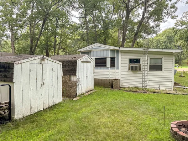 a front view of a house with yard