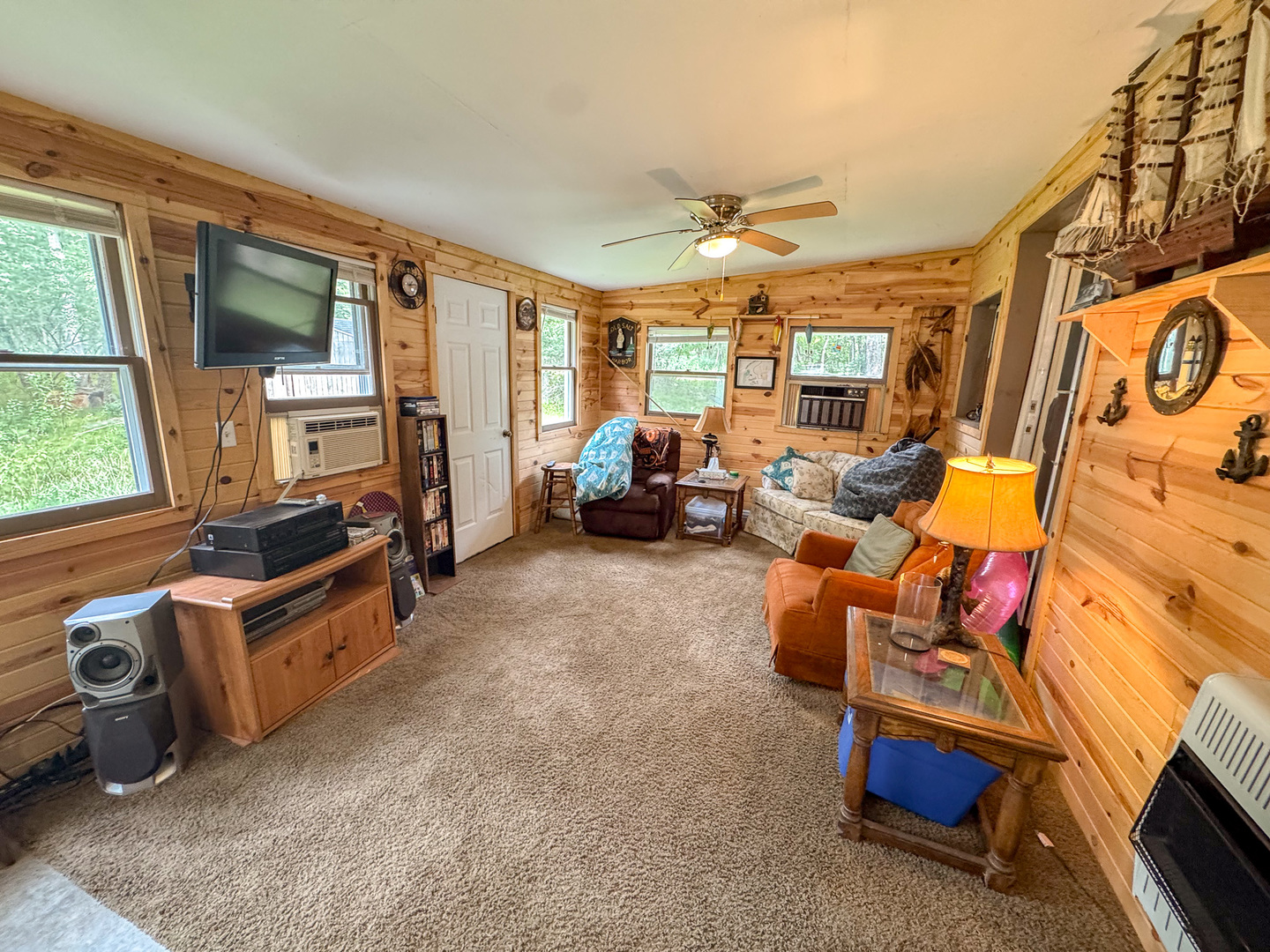 2-24 Woodhaven Sublette, IL 61367 - Photo 8 of 17 a living room with furniture and a flat screen tv