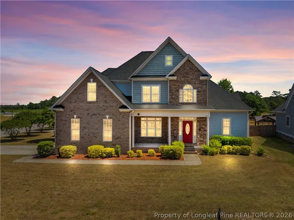 a front view of a house with a yard