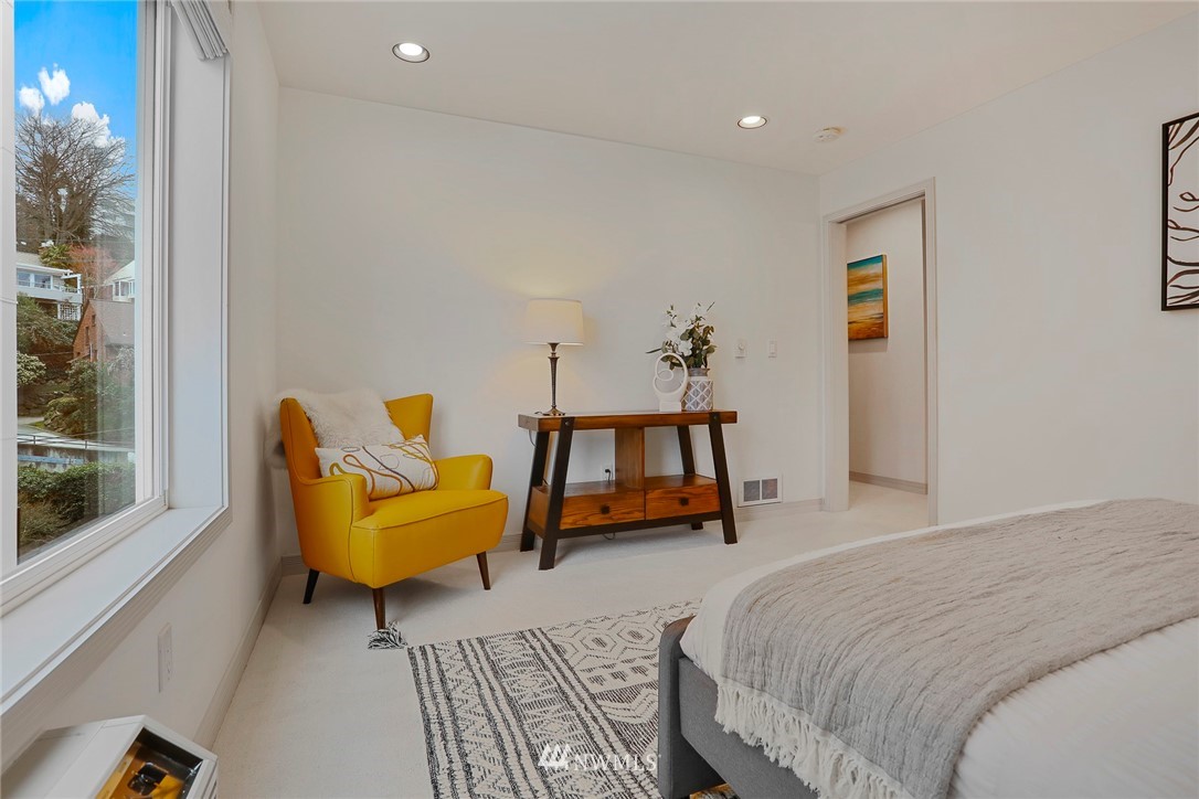 601 West Mercer Place, Unit 201 Seattle, WA 98119 - Photo 20 of 36 a bedroom with a bed and window